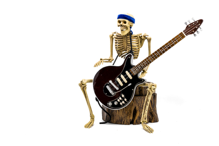 Model skeleton playing electric guitar, on white backgroundの写真素材