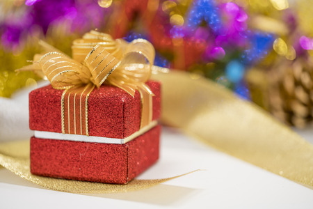 Red Christmas gift box with bokeh background.の写真素材