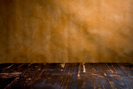 Dark vintage yellow room with wooden floorの写真素材