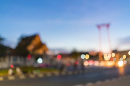 Blurred image of Giant swing and wat suthat in Bangkok, Thailand at twilight moment for background uses.の写真素材
