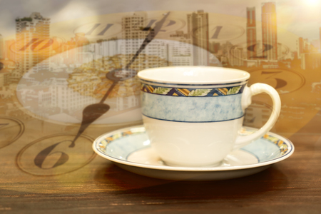 Double exposure of coffee cup with clock face.の写真素材