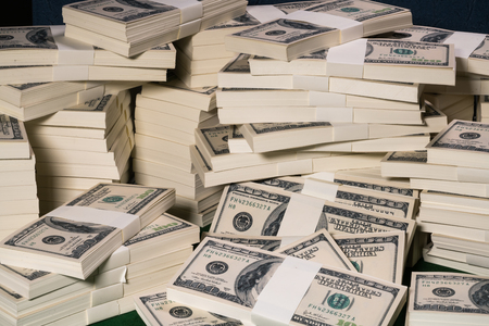 Stacks of one million US dollars in hundred dollar banknotes.の写真素材