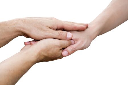 Close up hands of the young man holding the female hand on white backgroundの写真素材