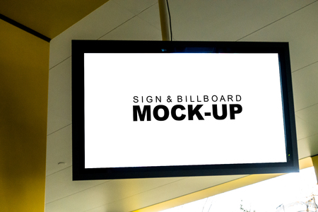 Close up and front view of the mock up white screen blank billboard light box is hanging on ceiling for information or advertisement with clipping pathの写真素材