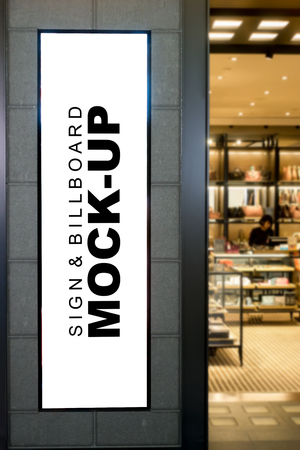 Mock up tall blank billboard for advertising with clipping path at front duty free showroom in airport, empty white space for promotion or informationの写真素材
