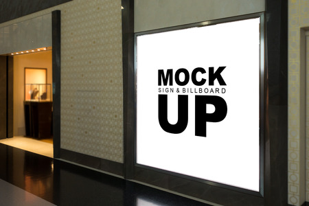 Mock up blank signboard with metal frame on the wall with clipping path at front of Jewellery shop, empty space with white screen for advertisement or promotion displayの写真素材