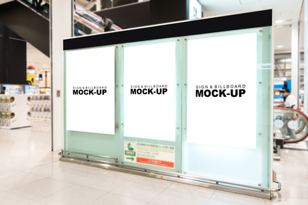 The mock up three empty space of signboard on big stand with clipping path at the airport, white screen for signage, advertising or information at public transport near duty free shopの写真素材