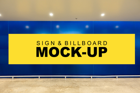 Mock up front view a large horizontal advertising billboard with clipping path on blue wall background in building, blank yellow screen empty space for in formation, advertisementの写真素材