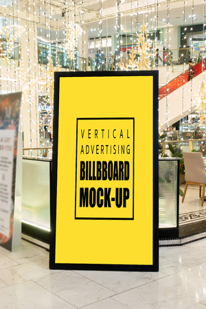 Mock up perspective the vertical blank billboard in black frame at walkway of shopping mall  , Yellow screen empty space for insert text or advertisingの写真素材