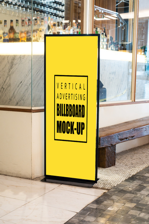 Mock up vertical blank billboard standing  at front of modern restaurant, Yellow screen empty space for insert text or advertisingの写真素材