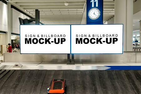 Two mock up blank horizontal billboard  at luggage conveyor belt of airport, empty space for advertising or public information, advertisement conceptの写真素材