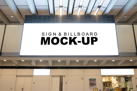 Mock up large horizontal billboard , signboard frame hanging from ceiling of hall over entrance, empty space for advertising or public information, advertisement conceptの写真素材