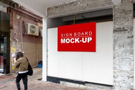Mock up perspective blank horizontal signboard with clipping path hanging from ceiling the building is mending, empty space for advertising or warningの写真素材