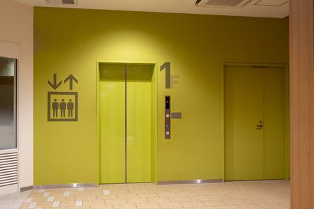 The Elevator in the modern building,  Closed gates entrance for transportation at first floor. empty space for advertising large indoor poster.の写真素材