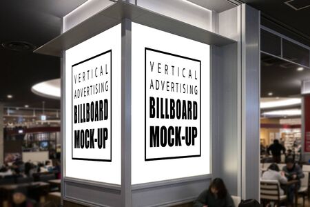 Mock up perspective two blank windows of signboard with clipping path on the pole at food court in shopping mall, empty space for insert advertising or announcement informationの写真素材