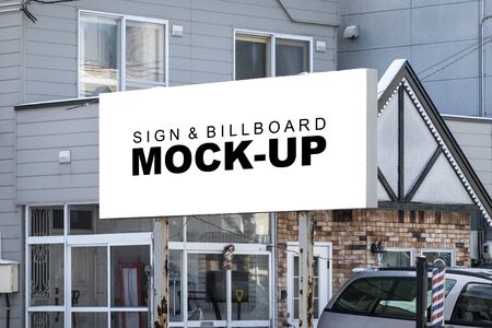 Mock up blank rectangular shape signboard with clipping path over entrance shop, Empty space for insert advertising graphic design or logo band or  company nameの写真素材