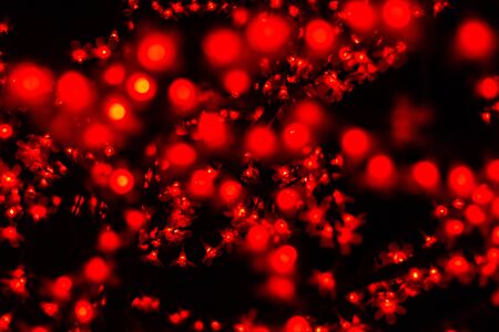 Bokeh red blurred lights abstract color background.