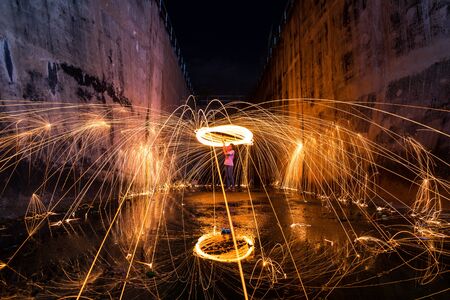 Photography Steel wool in different ways. Using a camera with shutter speed traction techniques Long-exposure .の写真素材