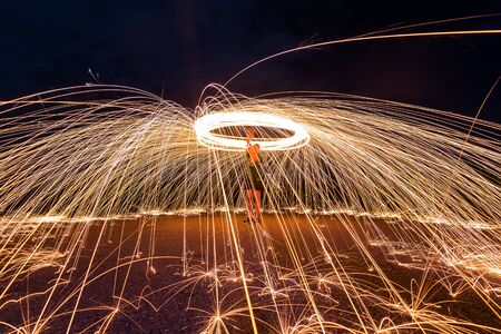 Photography Steel wool in different ways. Using a camera with shutter speed traction techniques Long-exposure .の写真素材