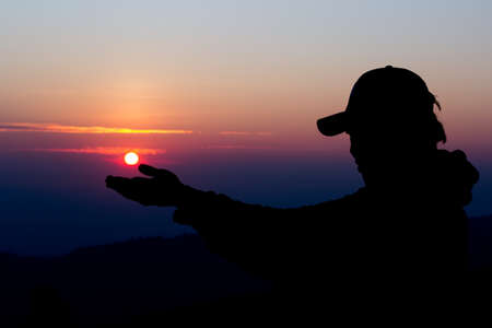 man silhouette Who are doing hand after the sun.の写真素材