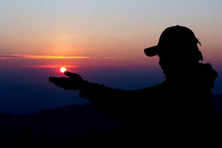man silhouette Who are doing hand after the sun.の写真素材