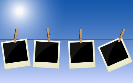 Four   pictures hanging on rope against bright skyのイラスト素材