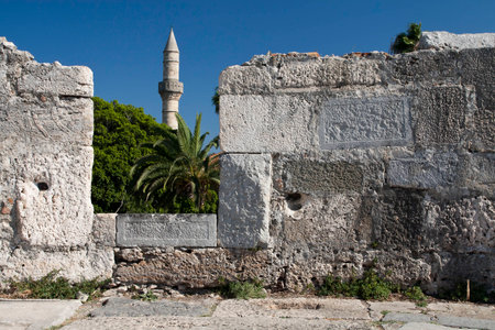 Minaret tower and castle wall in Kos city; Greeceの写真素材