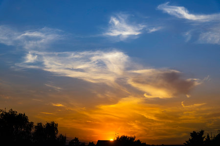 Sunset with dramatic clouds and colors in germanyの写真素材