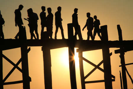 Sunset in U Bein bridge, Myanmar. U Bein bridge is longest teak bridge in the world.の写真素材