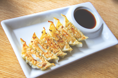 Asian appetizer menu fried dumplings with soy sauce Japanese toneの写真素材