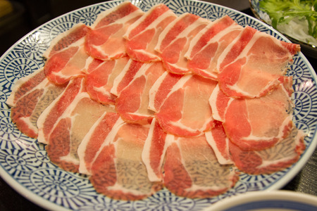 Slide raw pork on the table. Close upの写真素材