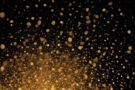 Gold glitter bokeh lights on black background. Gold bokeh lights on black backgroundの素材