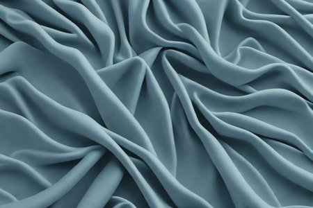 Closeup of rippled light blue satin fabric as backgroundの素材