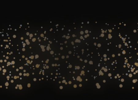 Golden bokeh on black background. Abstract gold glitter texture.の素材
