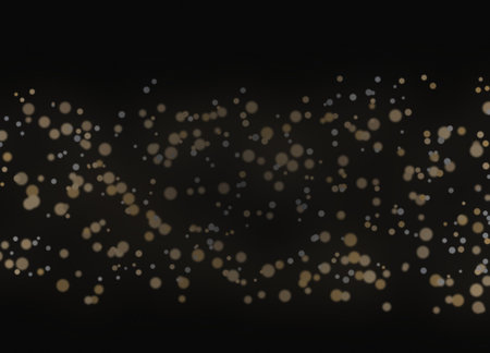 Golden bokeh on black background. Christmas and New Year concept.の素材