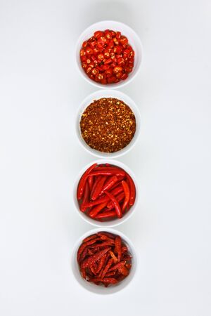four red spices in white cup (thai food Ingredients)