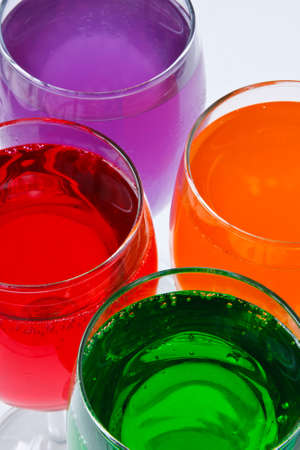 Glasses with colorful soda on a white backgroundの写真素材