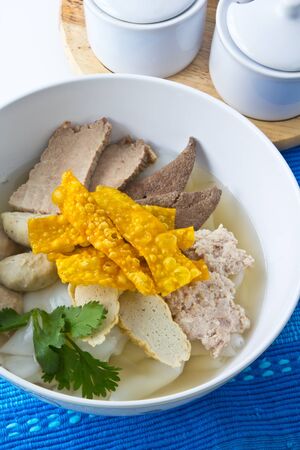 Popular thai fusion food, Chinese-style rice noodles in light soupbroth topped with meat and vegetables.の写真素材