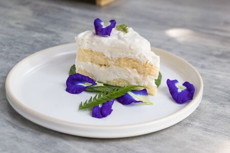 A fresh piece of coconut cream cake.の写真素材