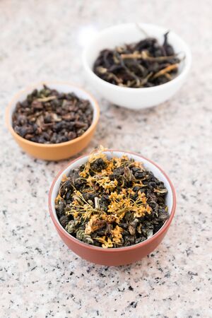 Rolled oolong tea leaves with sweet osmanthus flower, Traditional oxidized Chinese tea.の写真素材