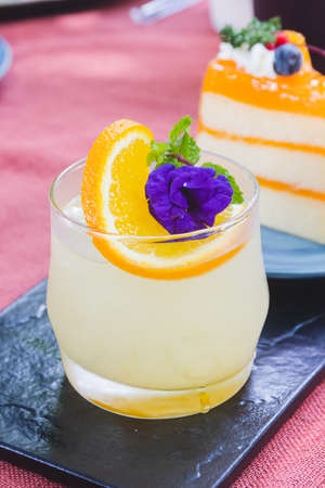 Japanese iced yuzu citrus tea. A glass of Iced yuzu fruit tea topped with sliced yuzu orange and...