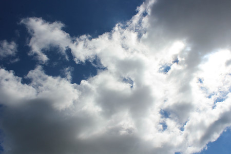 Puffy clouds blue skyの写真素材