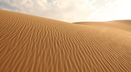 sand dunes and cloudless skyの写真素材