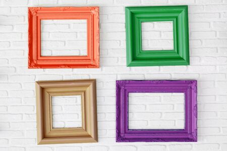 four photo frames on the white wall の写真素材
