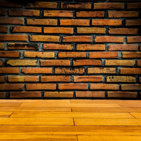 Red brick wall  with wooden floorの写真素材