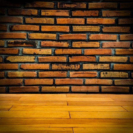 Red brick wall  with wooden floorの写真素材