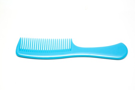 Blue comb isolated on white backgroundの写真素材
