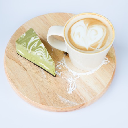 A cup of cafe latte and cake