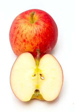 Red apple  and slice on a white backgroundの写真素材