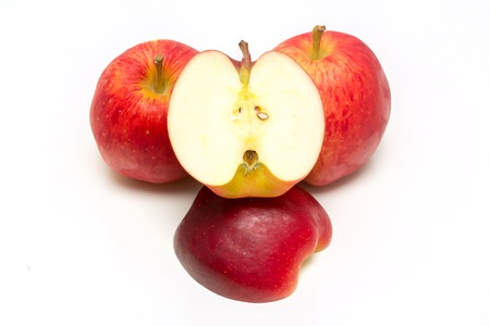Red apple  and slice on a white background.の写真素材